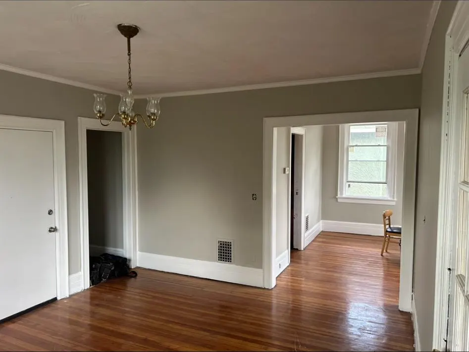Dining room with chandelier and hardwood floors