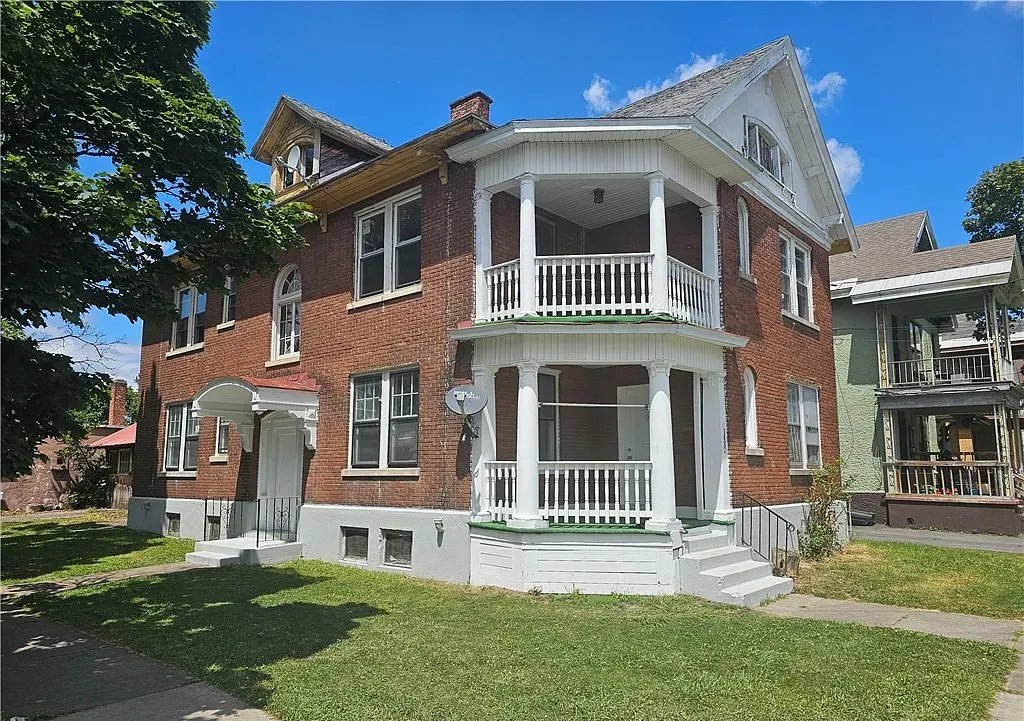 Two-story brick home with renovated double porches