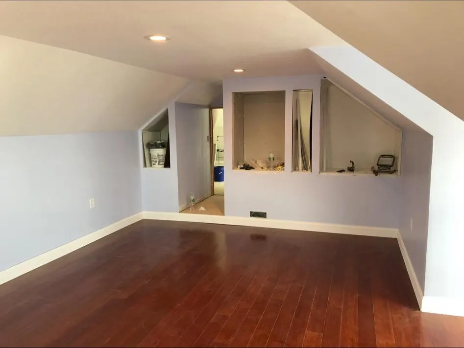 Finished attic room with hardwood floors