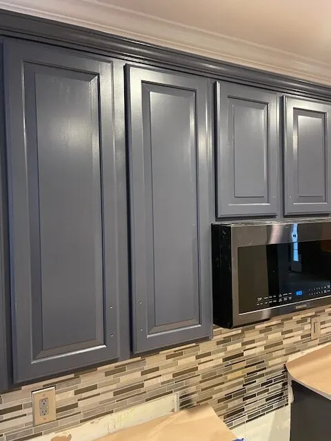 Cabinets and glass tile backsplash
