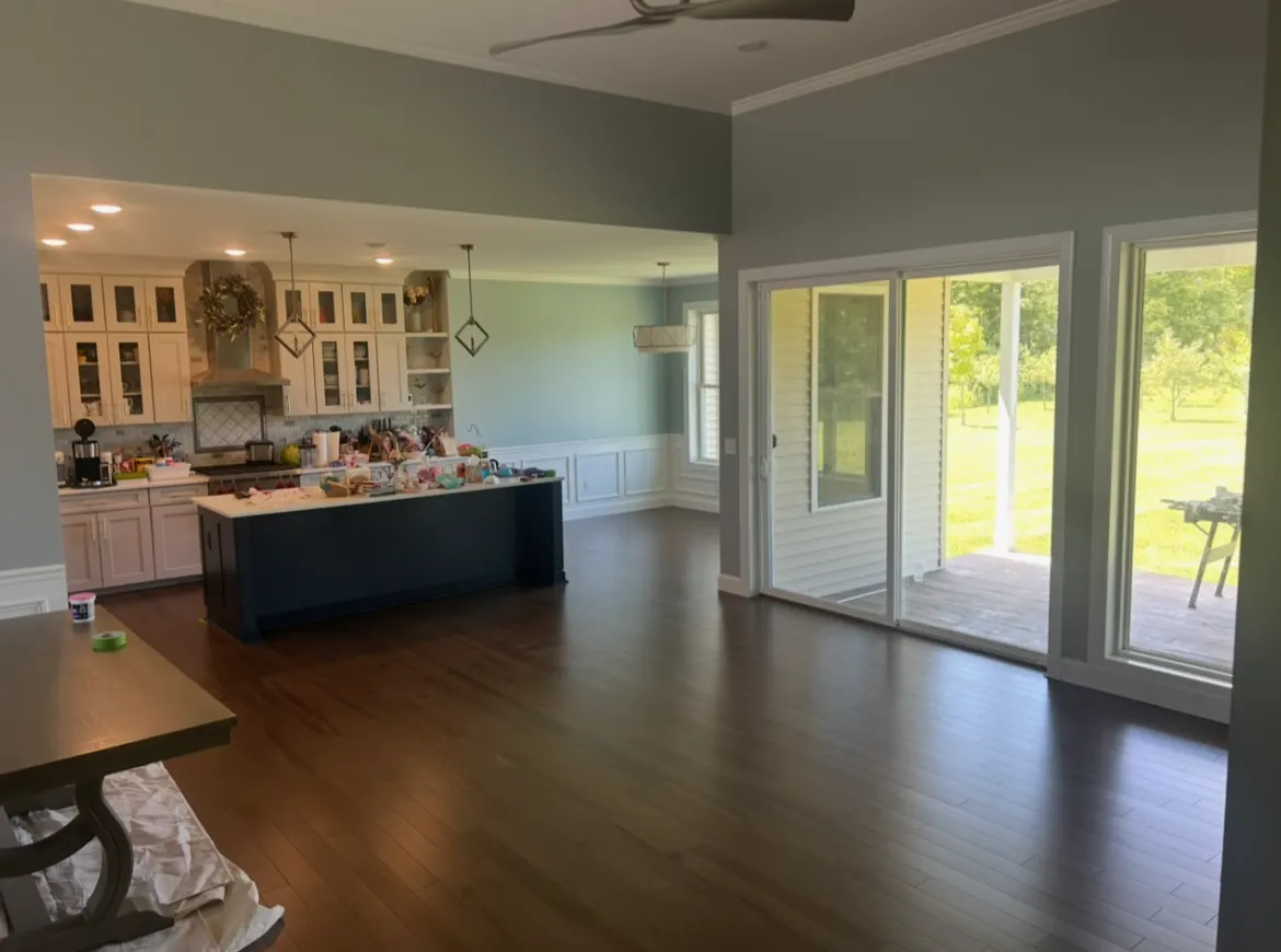 Open kitchen and living area with hardwood floors