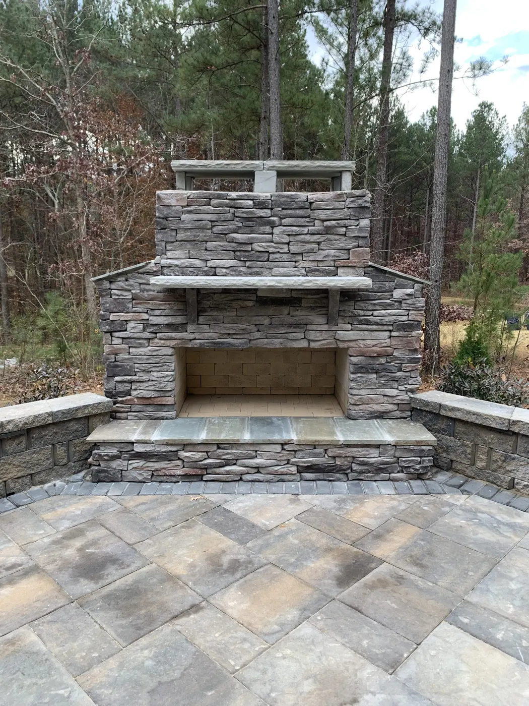 Stacked stone outdoor fireplace and patio